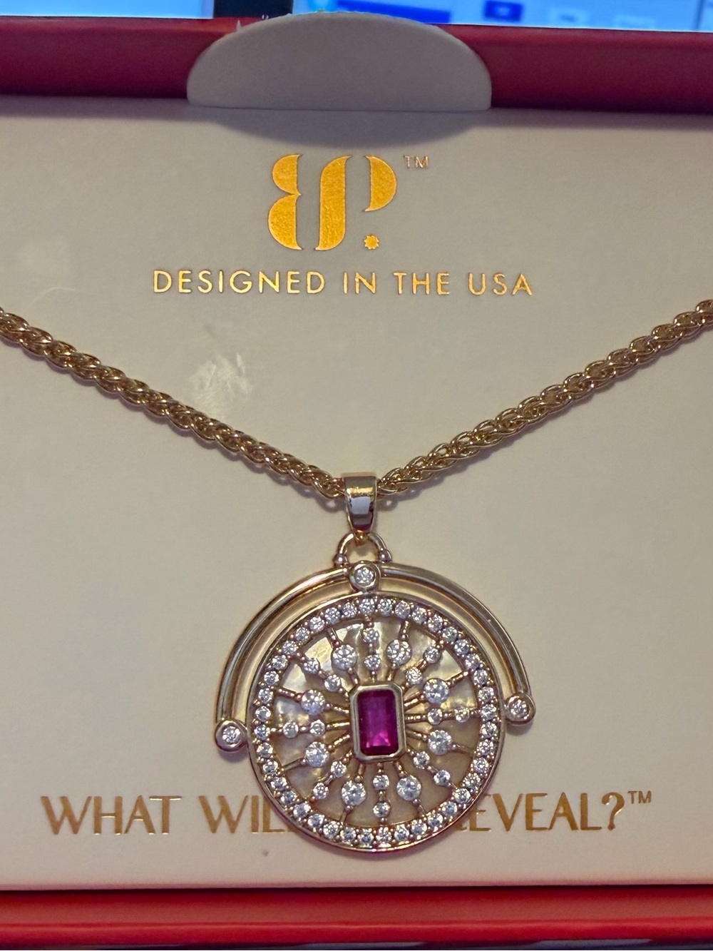BP reversible gold necklace. July 2026 Birthday collection, lab created Ruby.